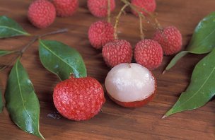 Lychee, Litchi chinensis, was first introduced into Hawaii 100 years ago but has been cultivated in China for nearly 4,000 years. Peeled before eaten, the fruit is whitish colored, as seen on the right.